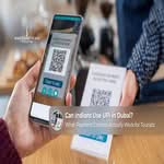Indian tourist using UPI for payments at a Dubai merchant.