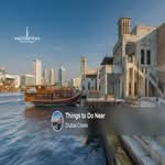 Visitors enjoying sightseeing, traditional markets, and waterfront experiences around Dubai Creek.