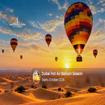 Hot air balloons rising over the Dubai desert during the early morning season.